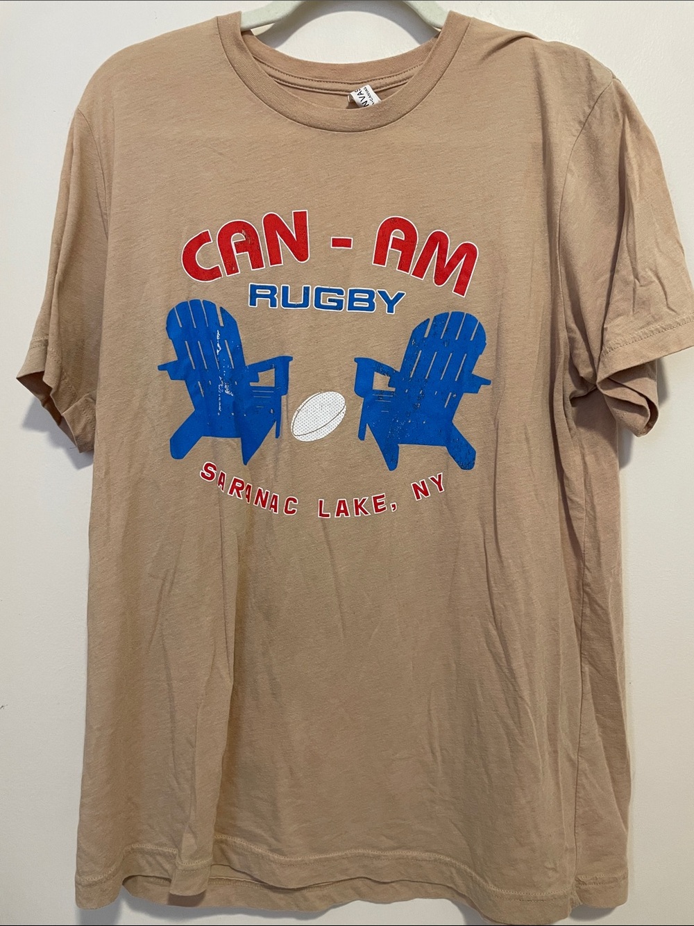 Bella Canvas Tan CAN-AM Rugby Tee with Blue and Red Graphics